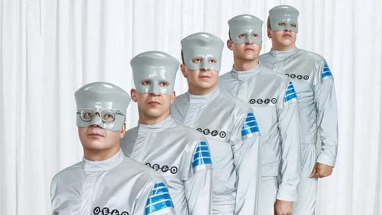 Devo: Mutate Don't Stagnate